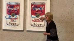 Protesters cover Andy Warhol’s iconic Campbell’s Soup Cans in blue graffiti