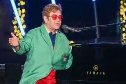 Sir Elton John and family step into Christmas as they surprise onlookers at festive display in New York