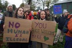 ‘Shut Manston down’ – hundreds protest outside migrant centre in pouring rain