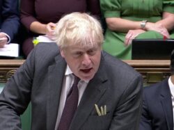 Why is Boris Johnson wearing a wheat sheaf on his lapel?