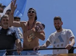 Emi Martinez holds baby doll with Kylian Mbappe’s face during Argentina’s World Cup parade