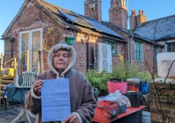 Eco-activist refusing to remove solar panels from historic cottage