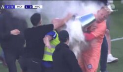 Melbourne City goalkeeper hit in face with metal bucket after throwing flare into crowd during Australian A-League pitch invasion