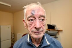 Pensioner, 81, held at knifepoint in own home by masked gang who beat him with crowbar