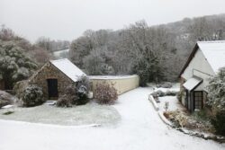 Snow sweeps in as cold snap continues