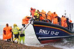 Shivering migrants brought ashore in Kent