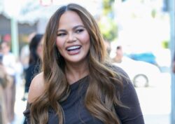 Chrissy Teigen breastfeeds newborn Esti while son Miles, 4, clambers over her and counts to 100 in hilarious video
