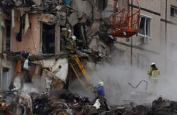 More than 20 bodies pulled from rubble of flat block after Russian strike