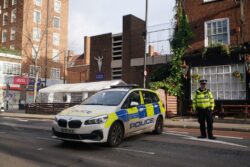 Man, 22, questioned over funeral drive-by shooting bailed by police