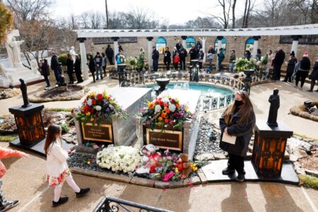 Lisa Marie Presley’s grave adorned with flowers as she lays to rest next to son Benjamin Keough following Graceland funeral