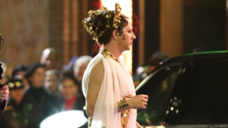 Shia LaBeouf looks worlds away from his usual self as he dons sparkly gold heels and white Grecian gown on set of Megalopolis