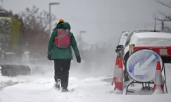 UK weather: snow and ice causes travel disruption across Britain