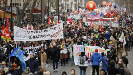 Hundreds of thousands protest across France against pension reform, unions vow to ramp up strikes