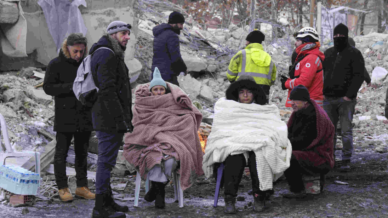Death toll tops 11,000 and Erdogan visits survivors