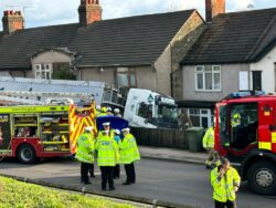 Man dies after lorry crashes into row of houses