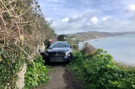 Mercedes driver takes wrong turn down coastal path and abandons car