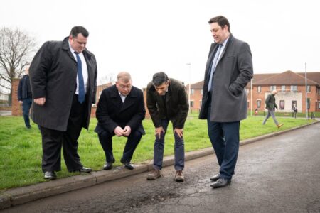 Rishi Sunak peers into potholes he’s pouring £200,000,000 into