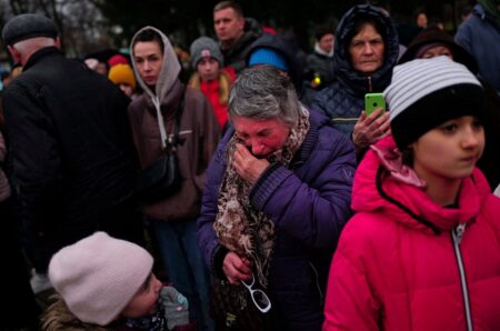 Bucha falls silent to mark a year since the city was liberated from Russia