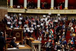 Macron’s government survives no-confidence vote