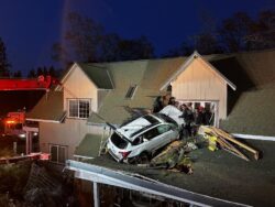 Car flies off the road and crashes through second story of home