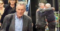 Sir Michael Palin, 79, comforted by friend in grieving comedian’s first public outing since wife’s death