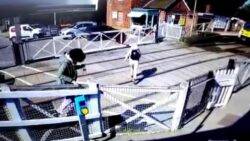 Woman two seconds away from being hit by train at level crossing