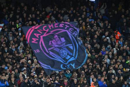 Why do Manchester City fans boo the Champions League anthem?