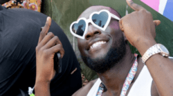 Stormzy is the epitome of Glastonbury joy in heart-shaped sunnies as he mixes with revellers to support fellow rapper Aitch