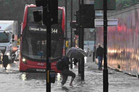 Met Office issues flood alerts across UK as wildfires rage in Greece