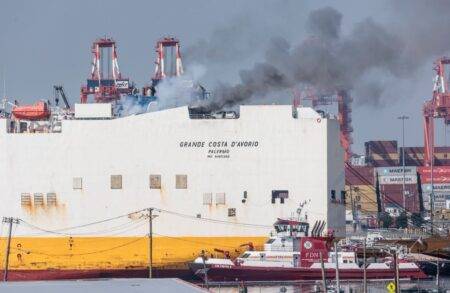 Two firefighters die trapped in cargo ship while battling blaze