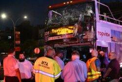 Double-decker tour bus and another bus crash in New York City, injuring at least 18