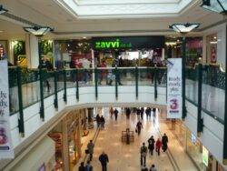 Woman in her 20s falls from balcony at shopping centre and lands on pensioner