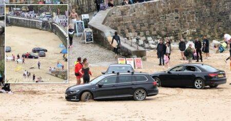 Locals perplexed after four cars get stuck on beach at the same time