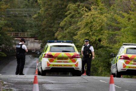 Two people die after driving car into flooded area of road