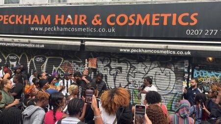 Peckham shopkeeper at centre of 'choking' row takes refuge from angry demonstrators in secret hideout