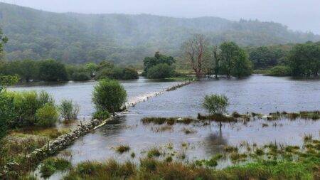 Flood warnings as rain leaves hundreds without power