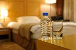 Flight attendant says you should always throw a water bottle under hotel beds