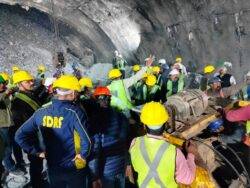 Frustrated relatives gather outside collapsed tunnel as trapped workers grow ill
