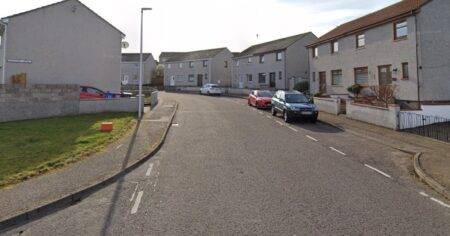 Police launch murder inquiry after woman found dead at property in Elgin