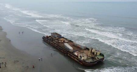 Two mystery ‘ghost ships’ wash up on beach and tourists start climbing on them