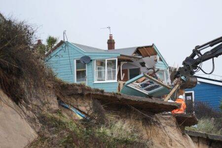 Clifftop homes demolished after coastal road collapses into the sea