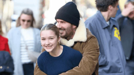 Doting dad David Beckham pulls Harper, 12, into giant bear hug in playful New York outing