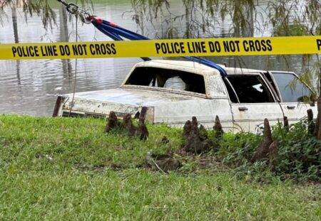 Three bodies found in car pulled from pond in front of shopping mall
