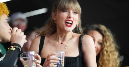 Taylor Swift declared an ‘icon’ after being filmed chugging a beer on Super Bowl big screen