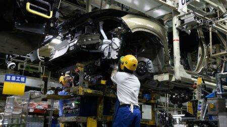 Japan avoids recession as growth figures revised