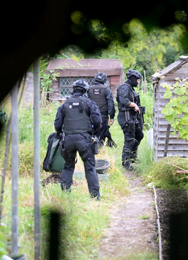 Police search in allotments in in the Hilly Fields area of Enfield