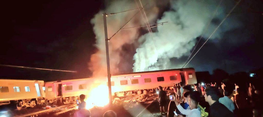 Around 10 coaches of a crowded train derailed & caught fire after it collided with a goods train 