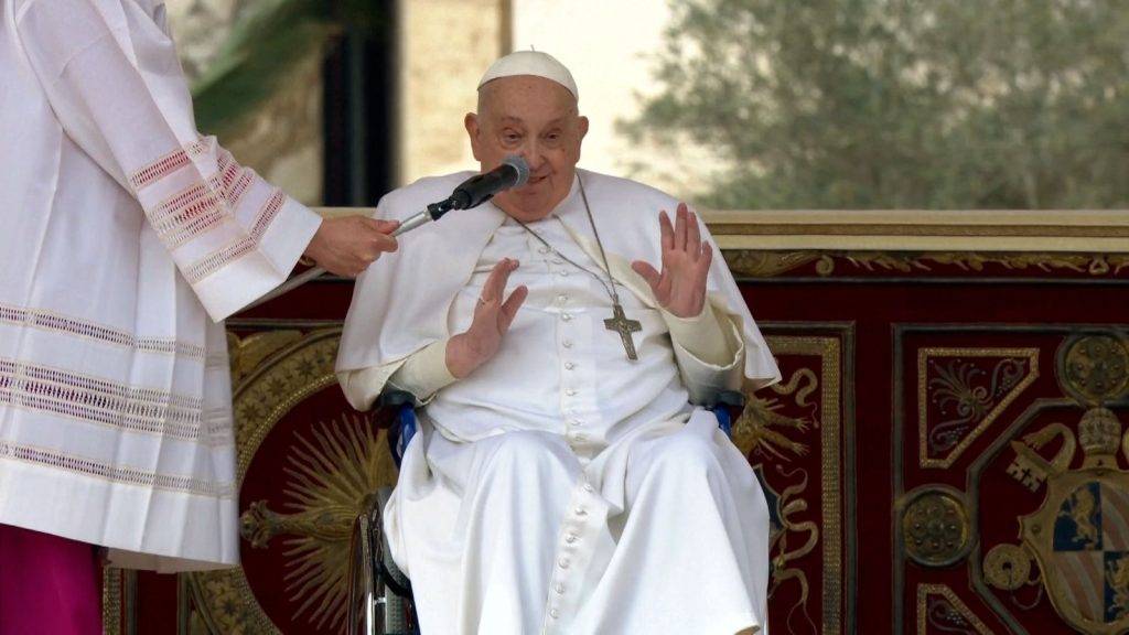 Pope makes appearance in St Peter’s Square for Palm Sunday mass