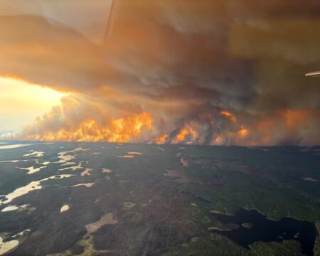 Thousands evacuate Manitoba as wildfires rage
