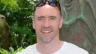 Liverpool man charged after car drove into parade crowd.